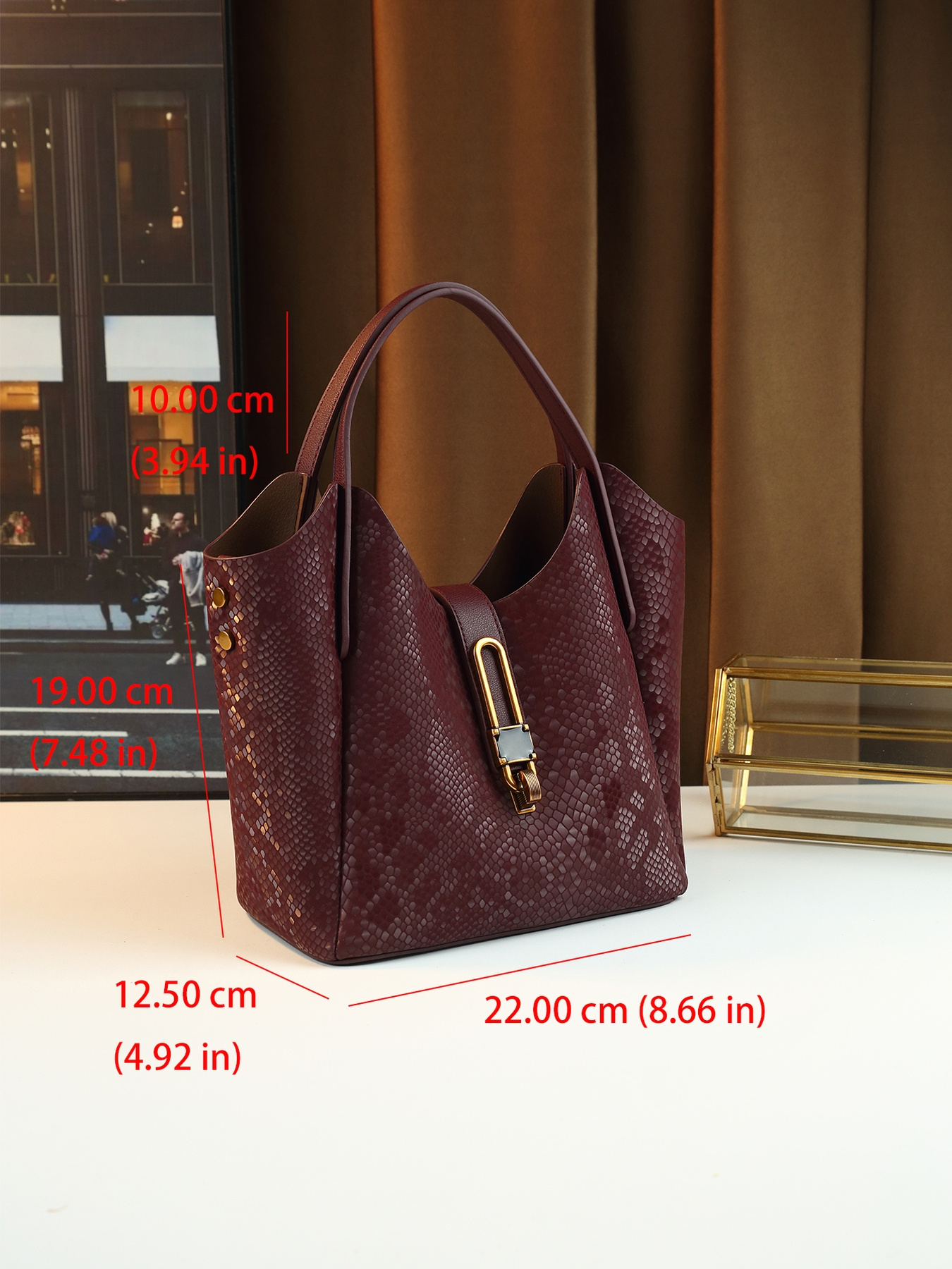 Coffee Gradient Snake Print Bucket Bag worn with dark outfit