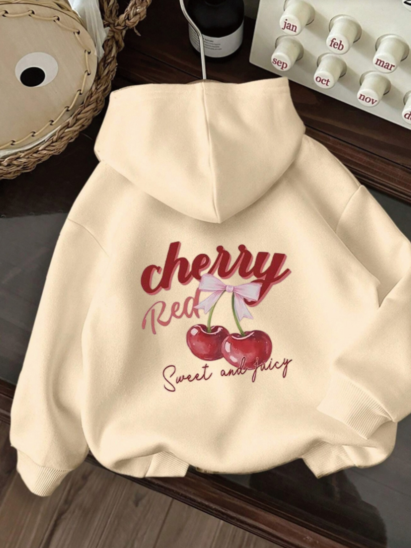 cherry sweatshirt sold on Temu United States