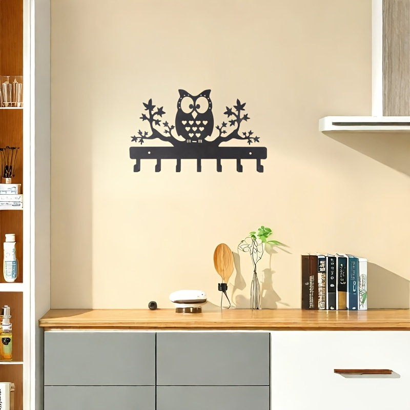 a wall mounted hook for coats featuring an     with   hooks suitable for entryway storage details 1