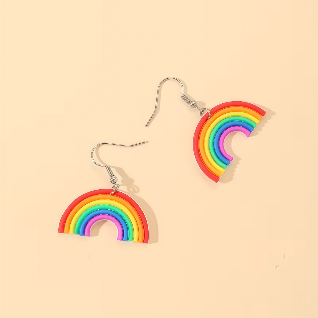 A Pair Of Colored Rainbow-shaped Earrings. The Earrings Of Silvery Hooks And Rainbow Pendants, Featuring A Easy Yet Design. A And Feeling. Full Of Whimsy And