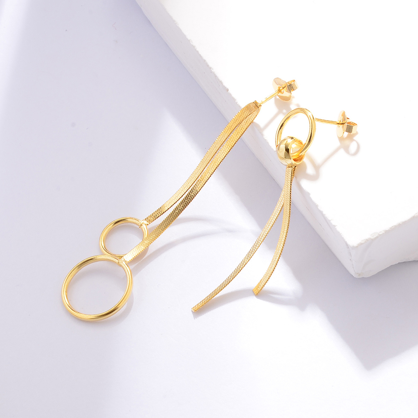 Women's Asymmetrical Circular Ring Snake Bone Chain Tassel Earrings
