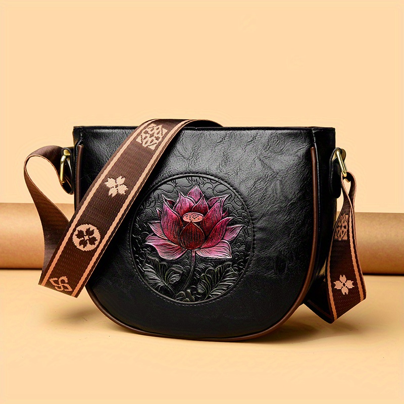 Image of A Cross-border Ethnic Style Embroidered Crossbody Bag, Featuring A Black Main Body With Pink Lotus, Measuring 23.5cm Wide, 20.5cm High, And 9cm Thick, With Patterned Webbing