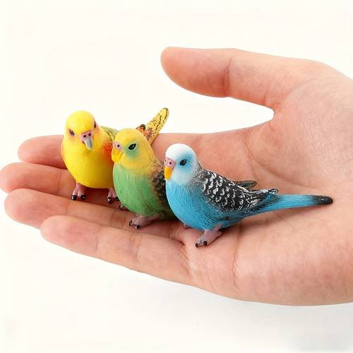 this 3pcs set of hand painted miniature parrot and black statues features colors that catch with