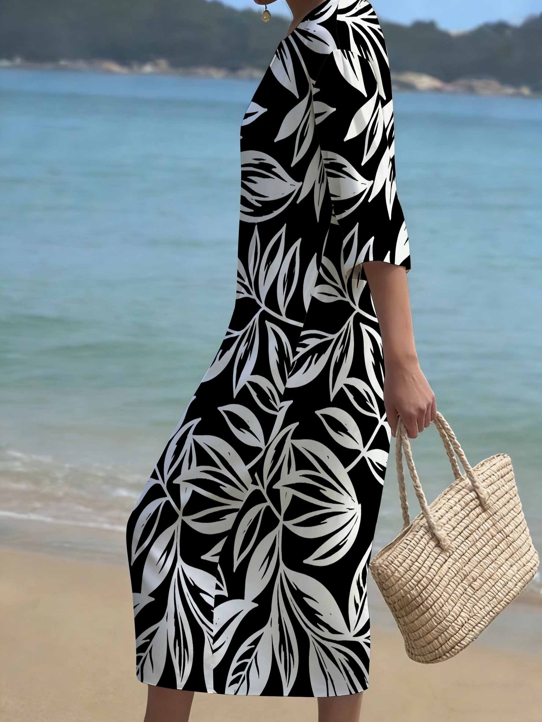 plus size plus size a loose fitting long sleeved dress for plus size women featuring a tropical leaf design showcasing a minimalist modern aesthetic this   dress has a round neckline