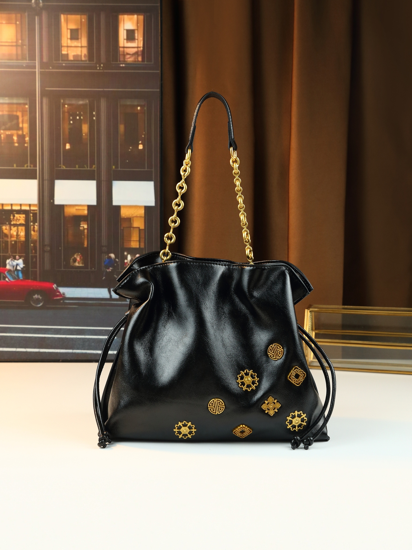 Black Drawstring Handbag worn on shoulder