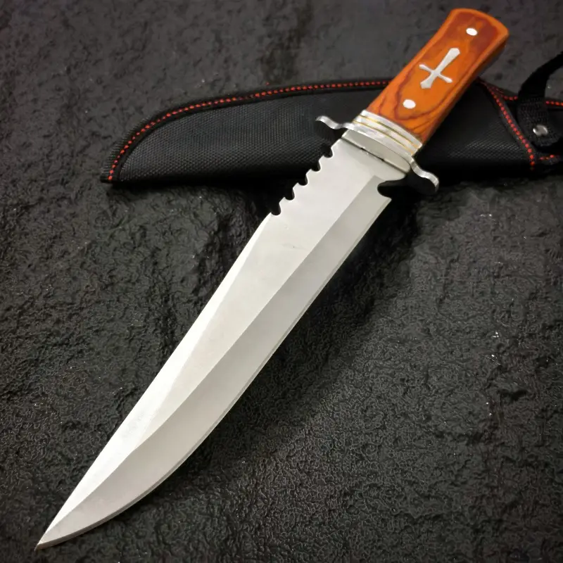 inch outdoor straight knife with a 7 4 inch blade length serrated design wooden handle with metal decoration with a black knife sheath a practical tool for the outdoors and a mens knife Product details 4