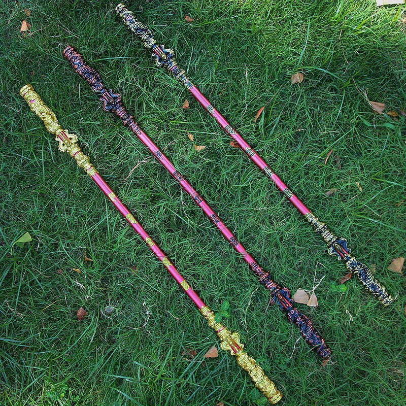 3 Sun Wukong Sticks with colorful patterns on a grassy background