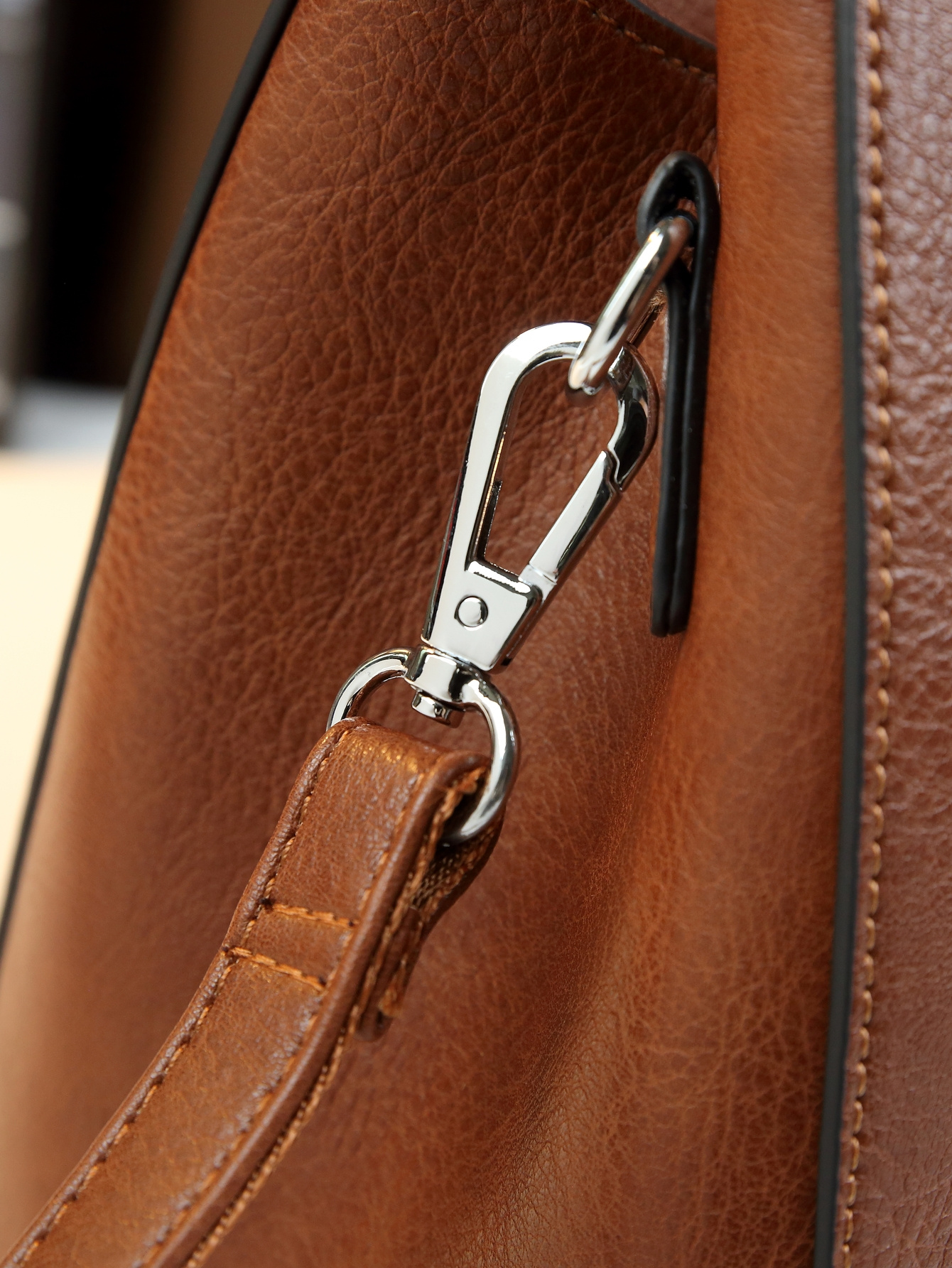 Light Brown Floral Print Handbag held by hand