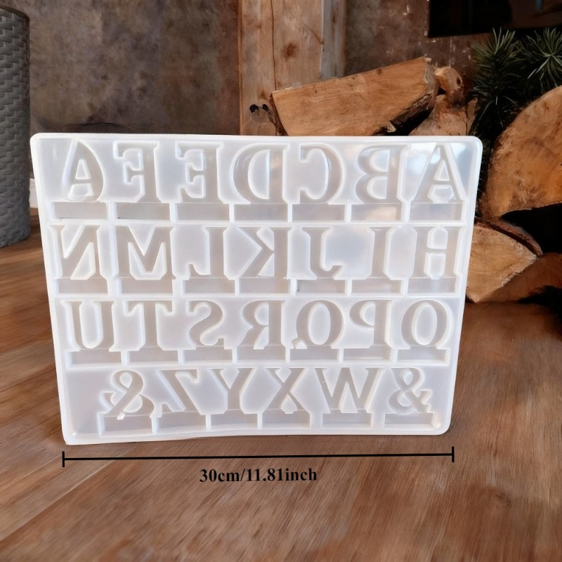 Image of Molds Made Of Silicone For Inserting Letters Into Ornaments, English Letters That Convey , Stones For Aromatherapy On Tables, And Molds For Crafting Candles