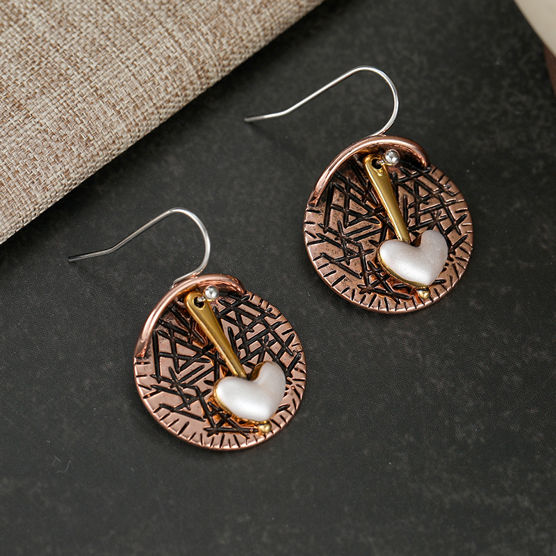 Women's Retro Elegant Heart Dangle Earrings with Artistic Relief Discs