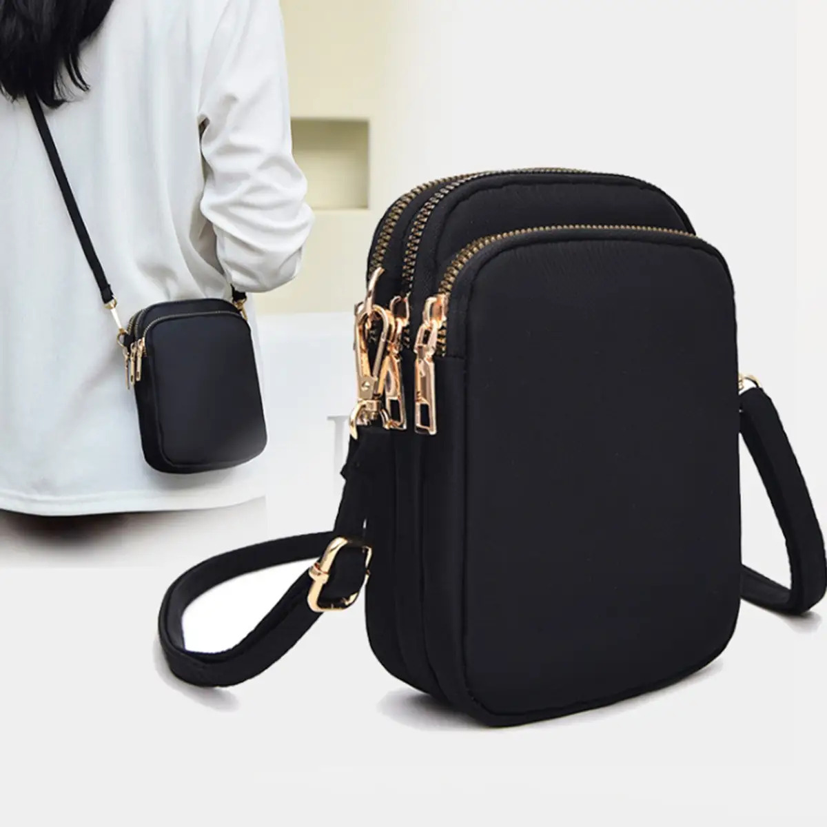 E-shop 1 Stück Damen Leichte Schwarze Nylon Umhängetasche für Handy mit Abnehmbarem Gurt & Goldfarbenen Beschlägen - Mehrere Reißverschlussfächer,