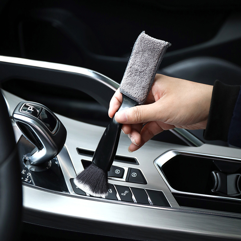 two items including one brush for car air vents     a dual headed tool for cleaning car   a brush for air conditioning vents a dust removal brush for car   and a soft brush suitable for washing cars without battery