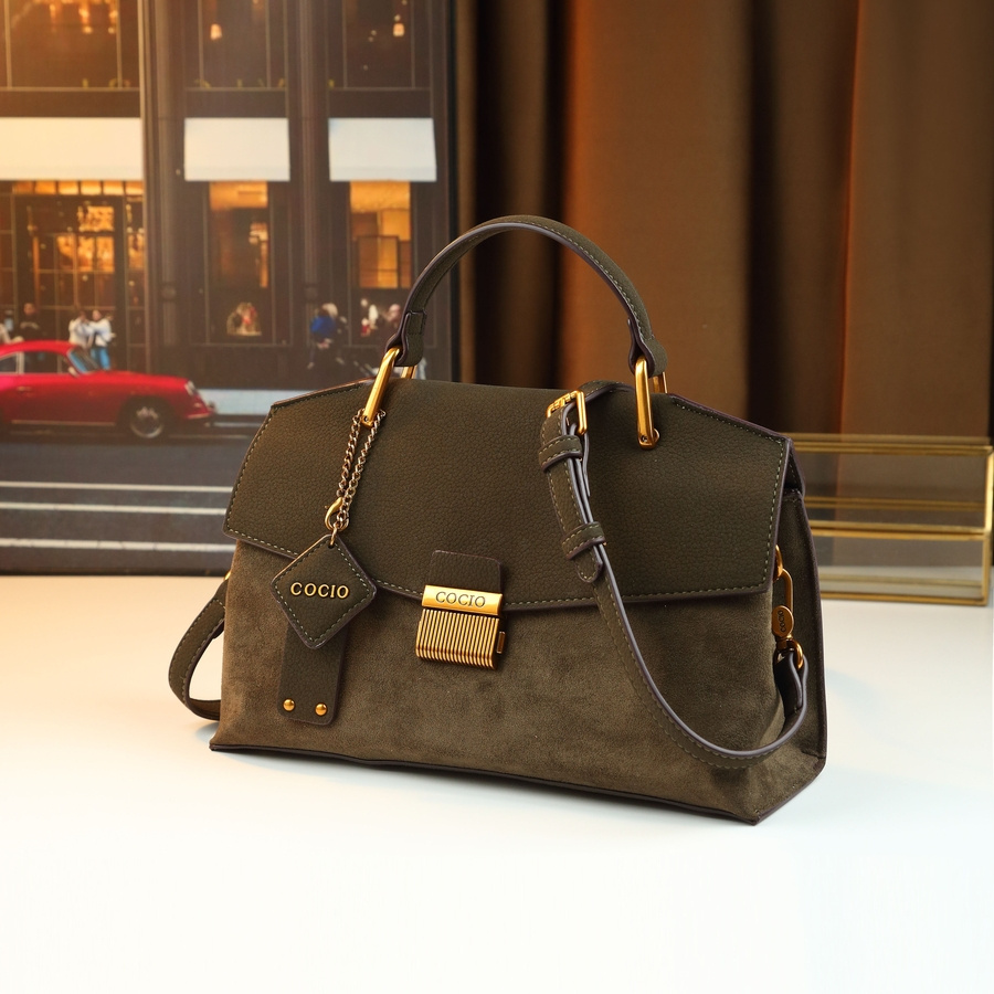 Handbag on table with coffee