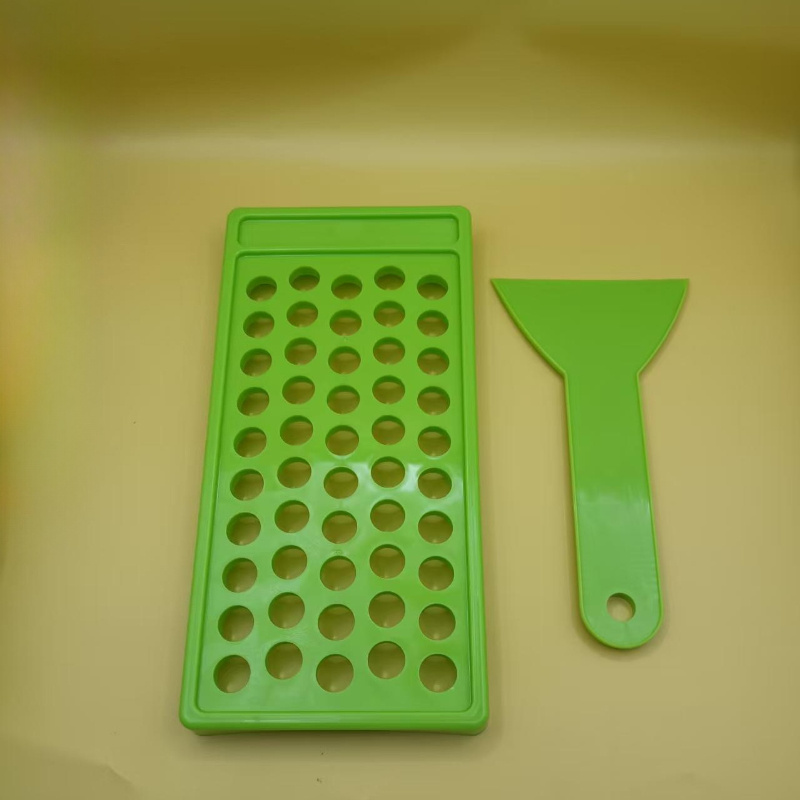 Image of A Lip Balm And Lip Gloss Making Kit, Including A Wax Pouring Tray, A Spatula, And A Scraper