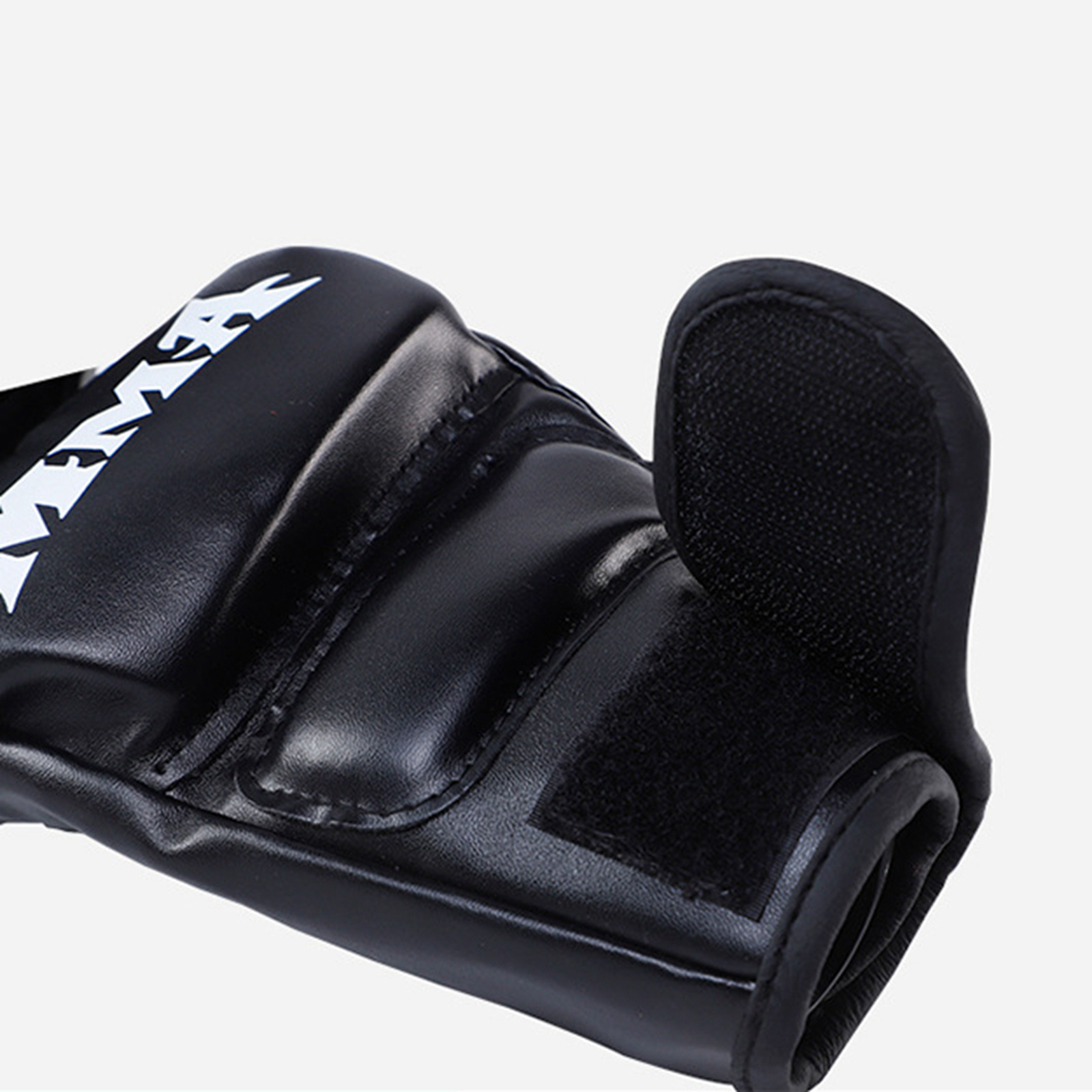 A black mma boxing gloves sold by 100 Spartans