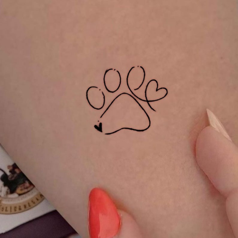 small dog paw print tattoo Iceland