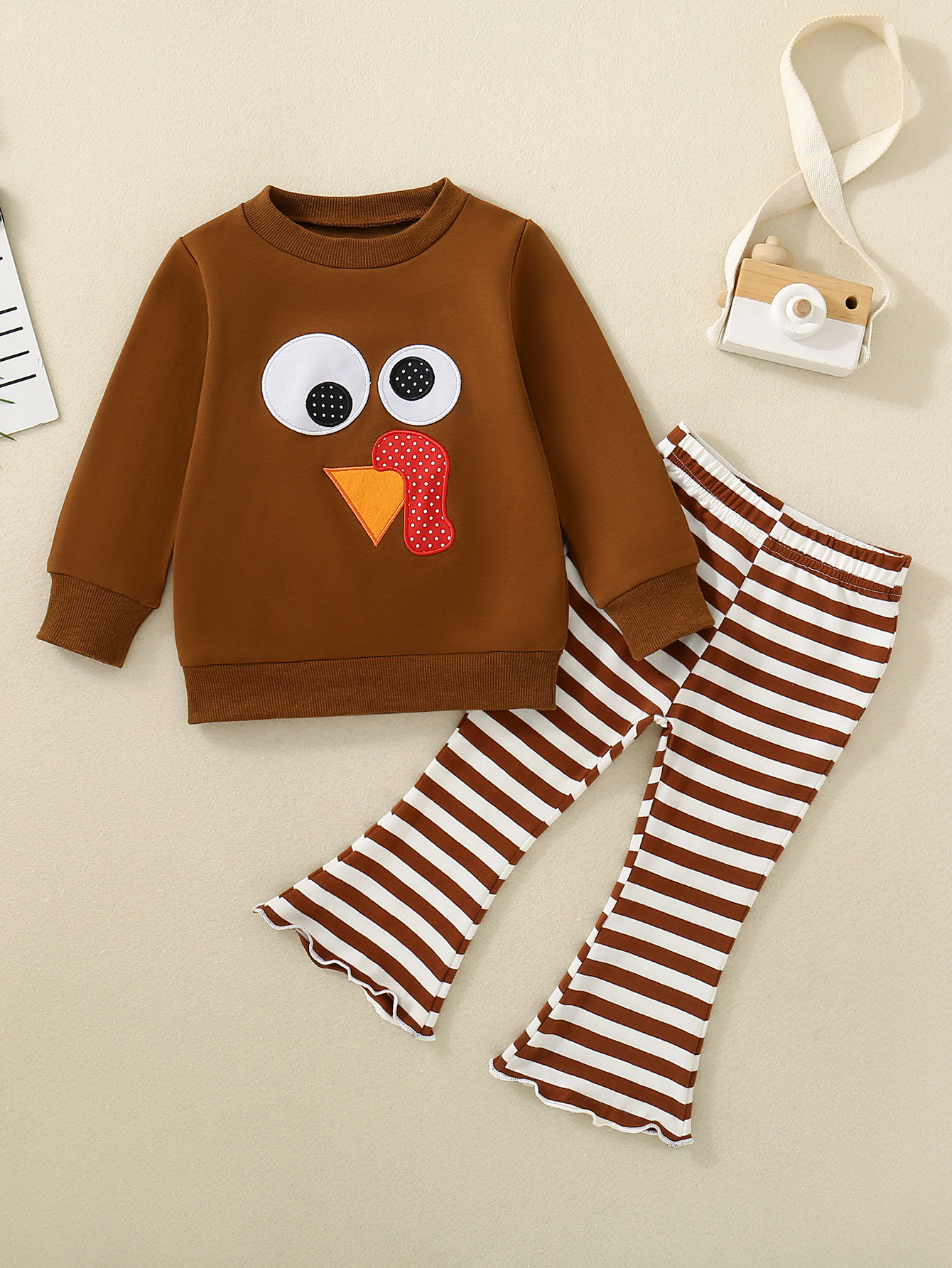 a cartoon embroidered brown sweatshirt with big eyes for baby girls   with striped flared pants       for outdoor
