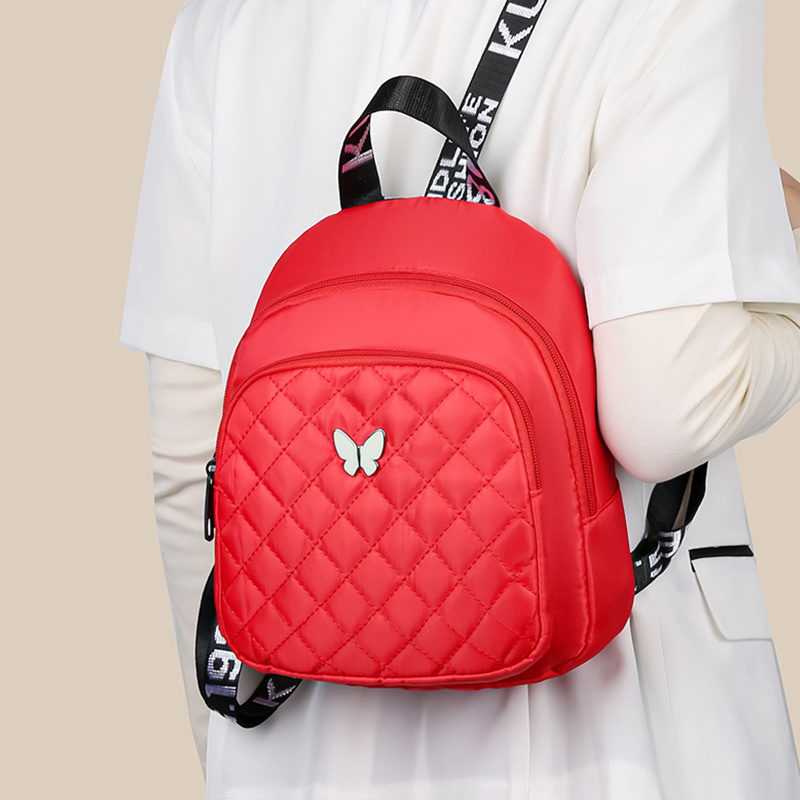 Mochila acolchada unisex, bolso de hombro para viaje y casual, con correas ajustables, múltiples compartimentos y logo de mariposa, disponible en 4 colores (negro, rojo, morado, azul), mochila para viajar con cierre de cremallera seguro