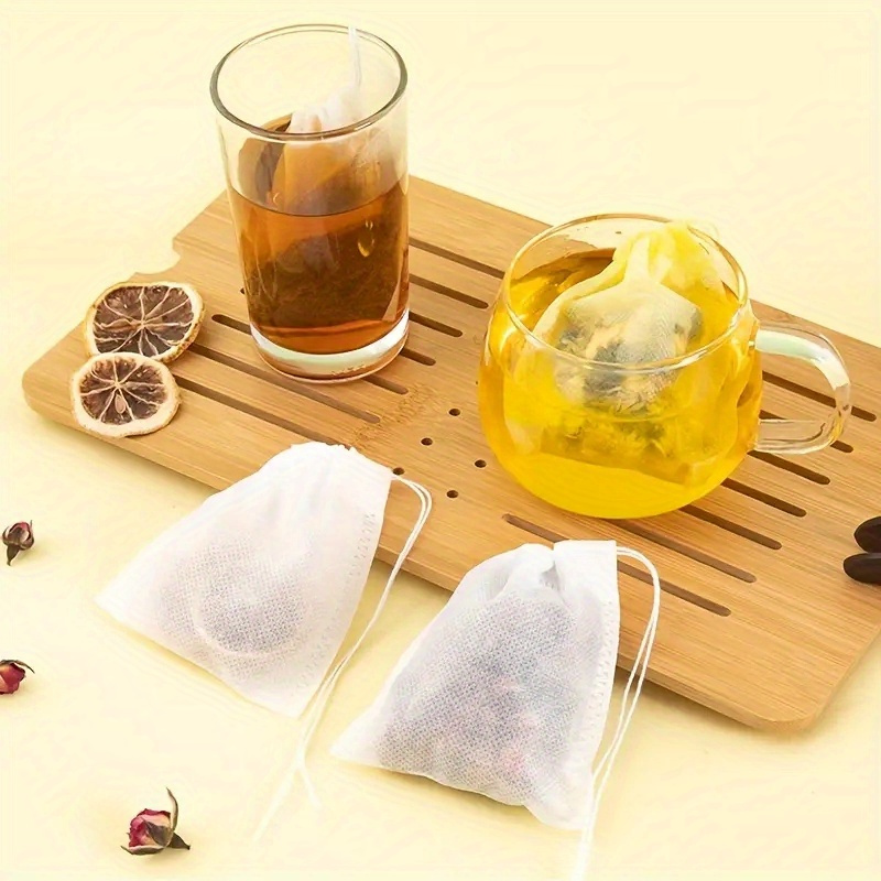 100pcs tea filter bags disposable mesh tea strainer with drawstring wash free for brewing tea coffee   food filter bags kitchen and dining supplies details 1