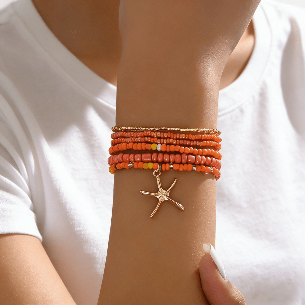 E-shop Ein Set aus 6 Damen-Boho-Armbändern im Urlaubsstil mit orangefarbenen Perlen und Seestern-Anhängern, für den , Strandausflüge und Partys