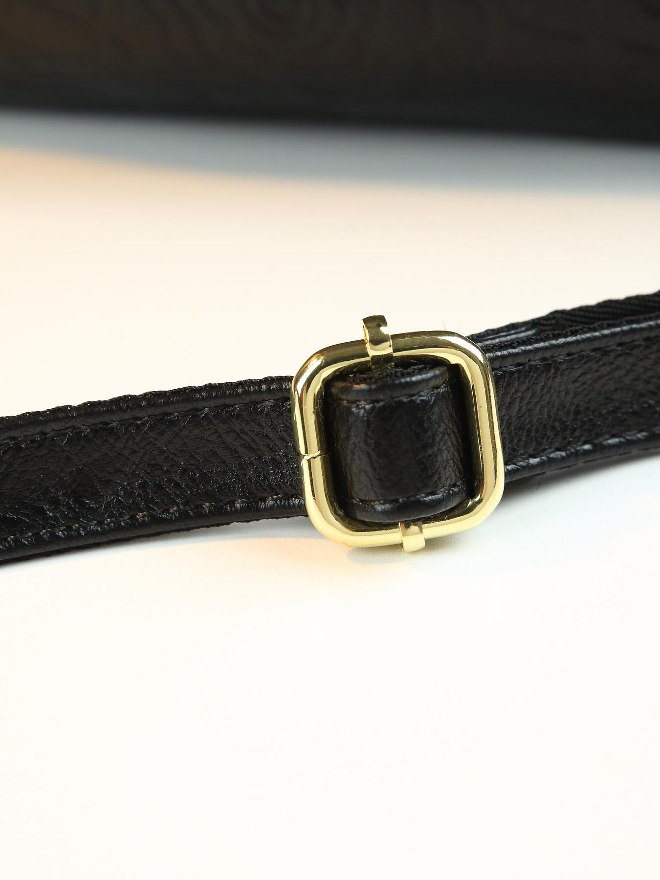 Back view of woman carrying bag