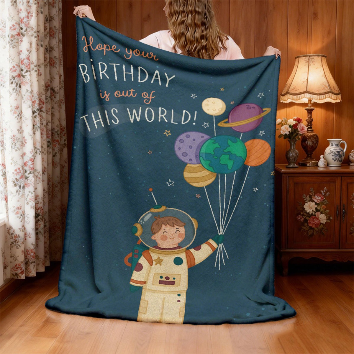 item picture one large comfortable flannel throw featuring a cute astronaut with balloons and planets design made from 100 polyester suitable for   machine washable   travel picnics and home decoration with a modern space theme
