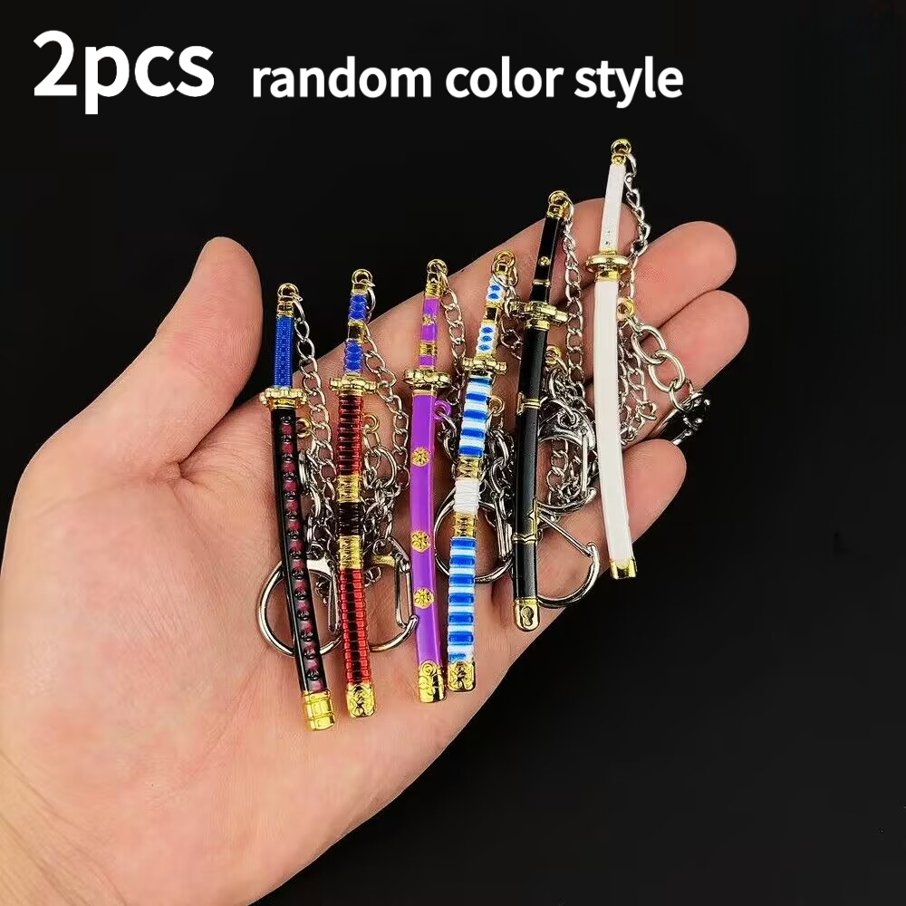TEMU 2 llaveros de estilo aleatorio con armas, perfectos para coleccionistas de anime y juegos. Al mismo , también son ideales como decoraciones para