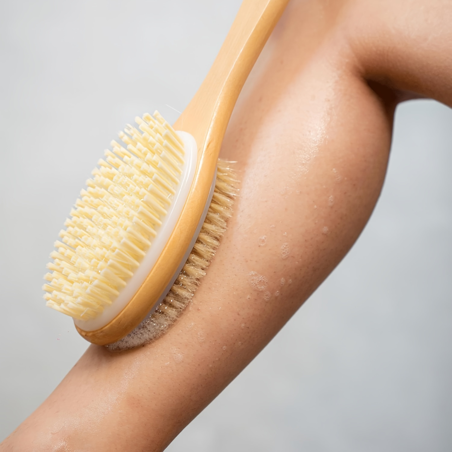 dual sided bath brush with a long handle brown bristle body scrubber removes dead skin     cleanses non absorbent suitable for lotion application no power required   in all   Product details 8