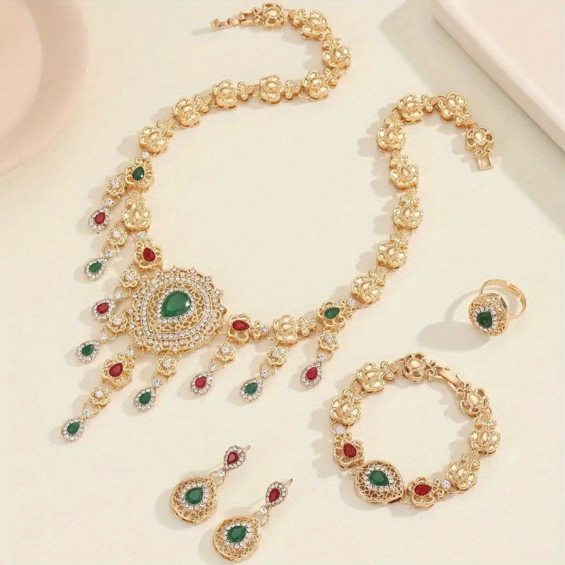 Ladies' Jewelry Set Including a Necklace, Earrings, Bracelet, And Ring, Featuring Rhinestone Embellishments. Stylish, Elegant, And Luxurious, Perfect for Weddings, Banquets, Parties, And Formal Occasions.