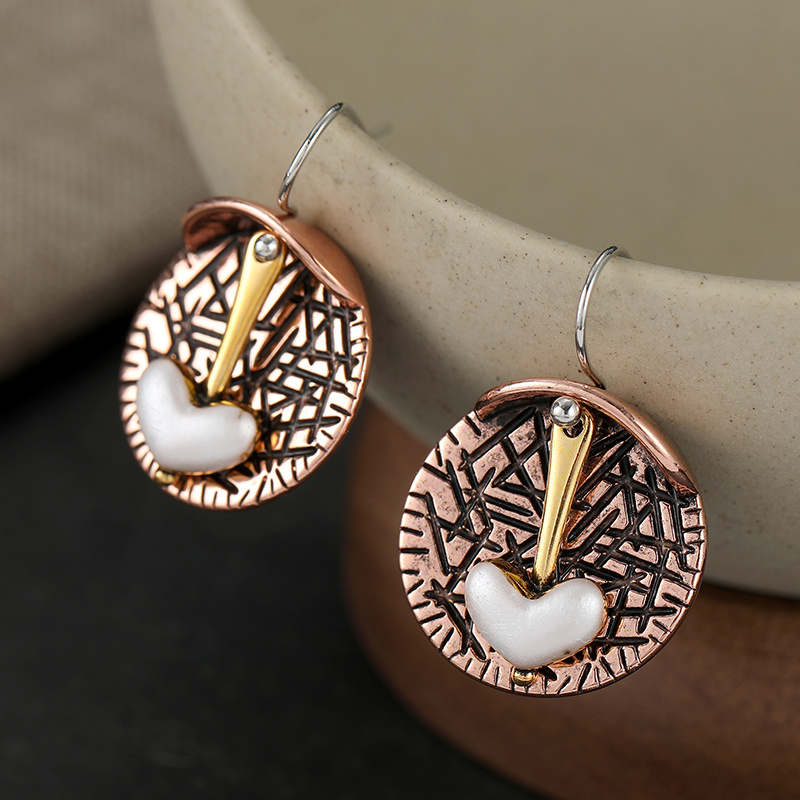 Women's Retro Elegant Heart Dangle Earrings with Artistic Relief Discs