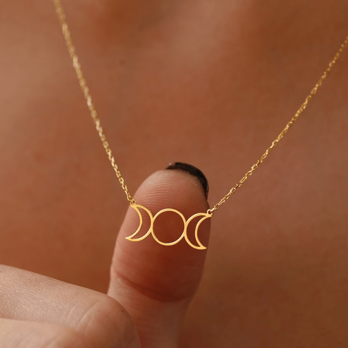a stylish and minimalist gold-plated geometric moon stainless