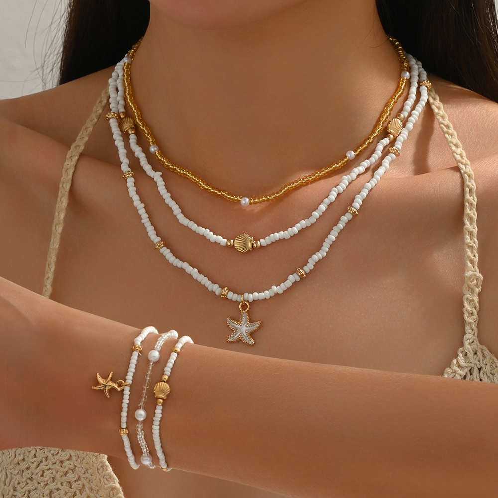 E-shop 6-teiliges Sommerstrandurlaub Muschel Seestern Anhänger Reisbead Perlen Choker Halskette Armband Einfacher Girly Stil Künstliche Perle Inlay