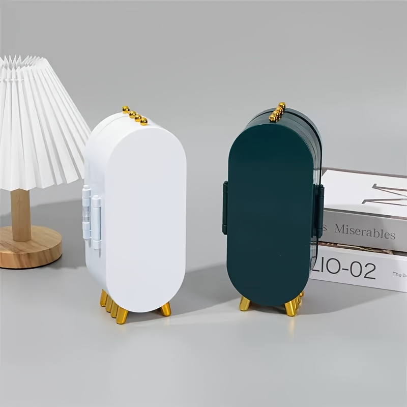 a foldable jewelry storage box with a   featuring a large capacity earring and necklace holder with   designed as an attractive display case for dressing tables it   a foldable earring clip jewelry organizer Product details 0