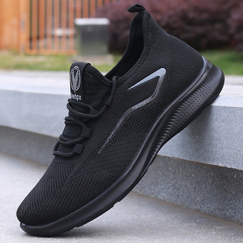 mens everyday sneakers   breathable fabric lightweight md sole and a low top lace up style for year round   black featuring white branding and text versatile footwear contemporary casual footwear   fabric sneakers Product details 0