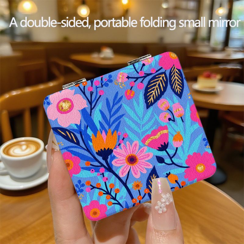 TEMU Compact And Portable Double-sided Folding Mirror Featuring A In Pink, Blue, And Orange, Cosmetic Applications. Its Decorative Ideal For A Cozy