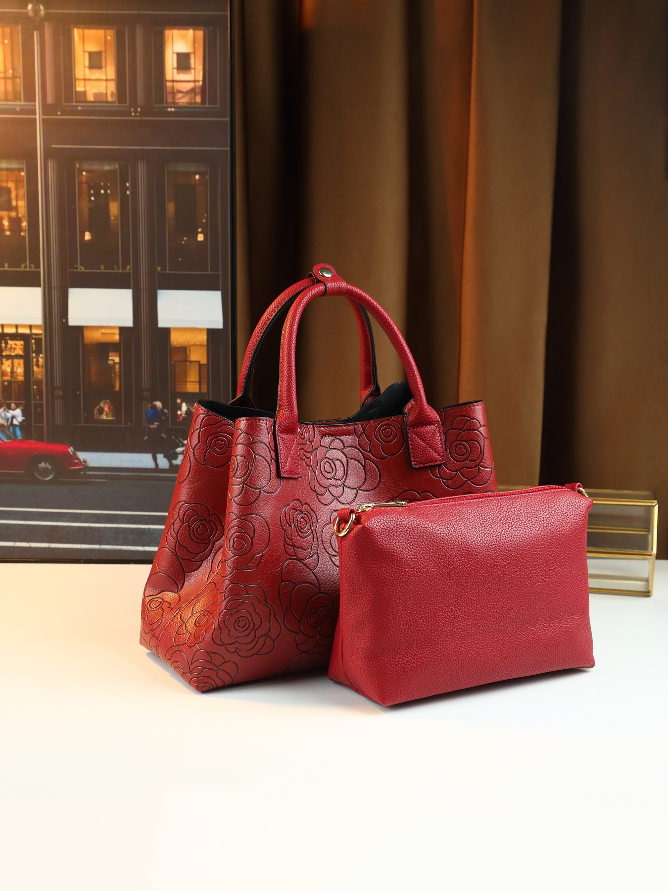 Model carrying bag over shoulder