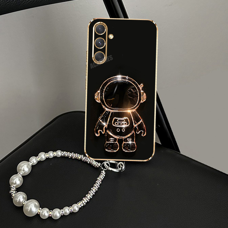 เคสโทรศัพท์ - เคสป้องกันการกระแทกสำหรับ Samsung Galaxy A16, A26, A36 และ A56, มาที่จับแบบพับ 3D รูปนักบินอวกาศ,…: retailer-supplied image