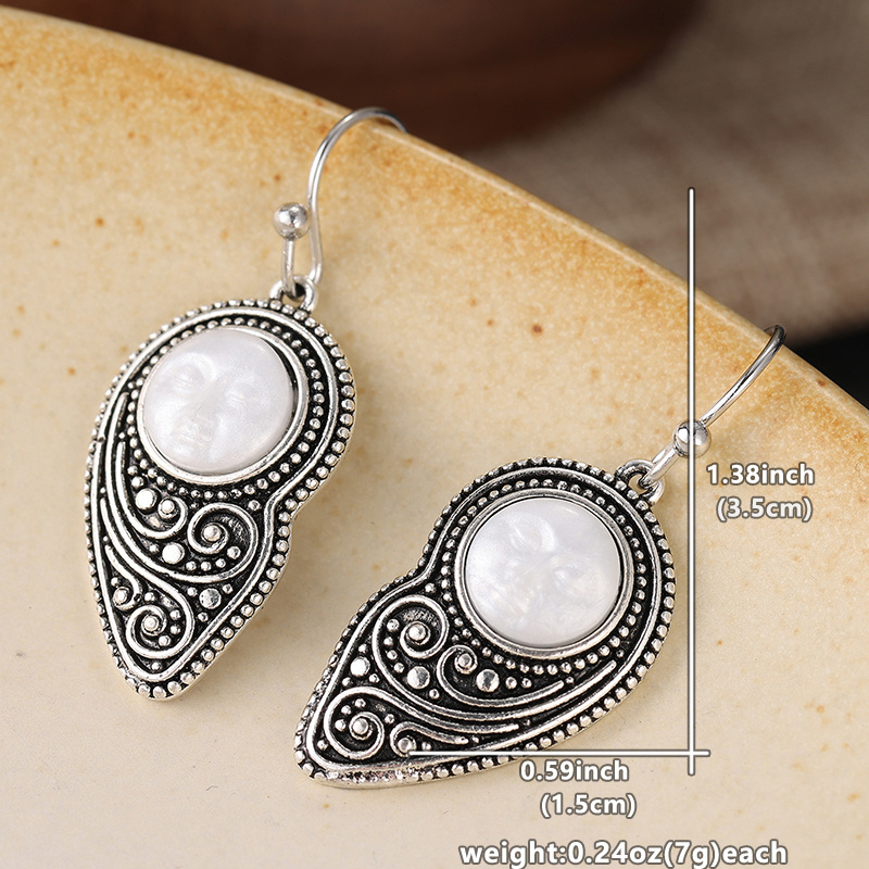 Vintage-style Silvery Teardrop Earrings with Embossed Design