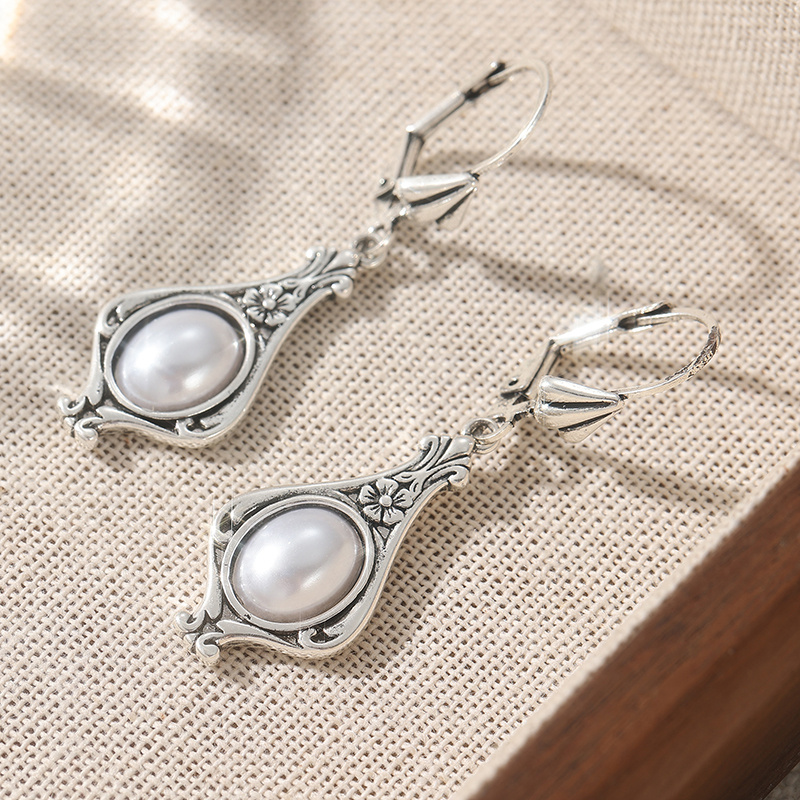 Image of Pair Of Hand-carved Drop-shaped Pendant Earrings Minimalist Style, Elegant Women's Accessories, Are The Perfect Birthday Gift For Occasions Such Festivals And Celebrations.