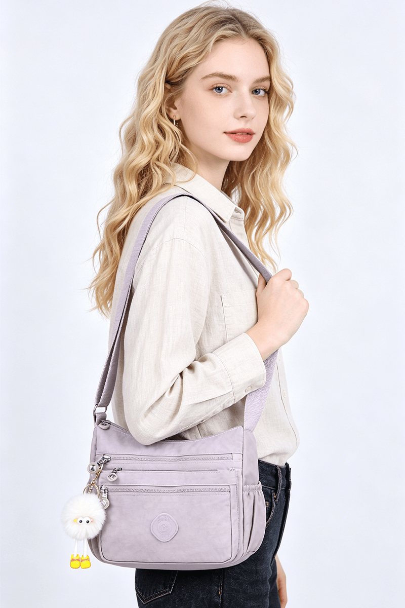 stylish lightweight multi pocket unisex crossbody bag with pendant elegant durable womens shoulder bag sturdy anti theft womens crossbody bag durable fabric multiple compartments adjustable straps perfect for travel daily use commuting Product details 3