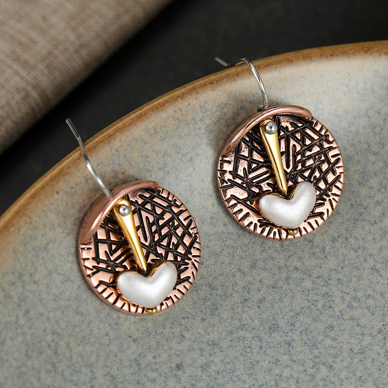 Women's Retro Elegant Heart Dangle Earrings with Artistic Relief Discs