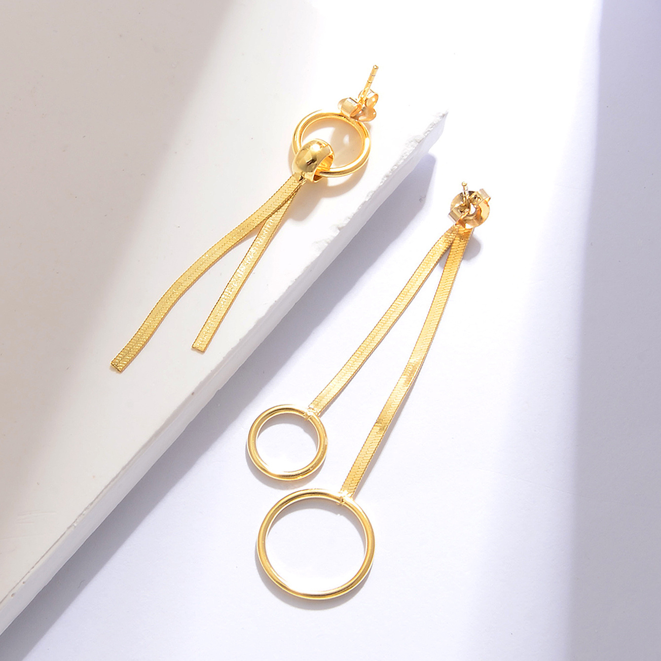 Women's Asymmetrical Circular Ring Snake Bone Chain Tassel Earrings