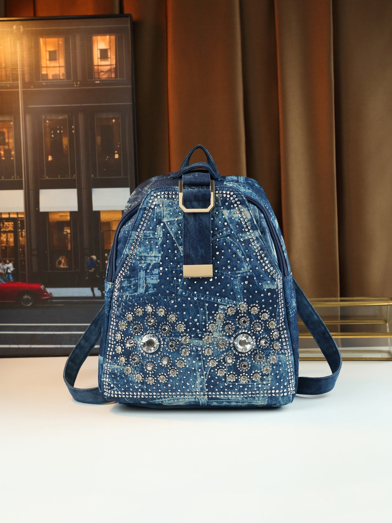 Close up of rhinestone sunflower on denim