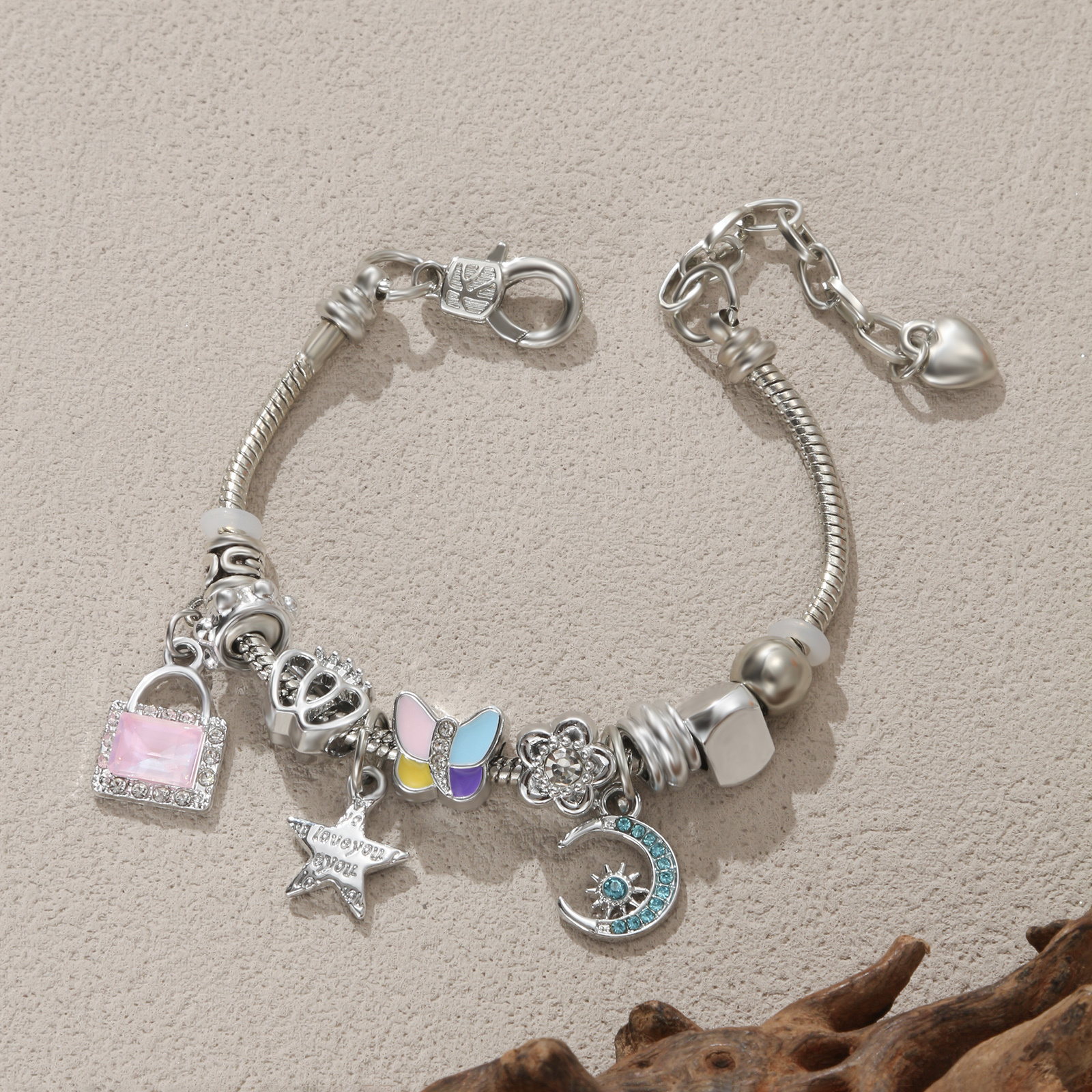 Fashionable Gift For Women Featuring A Silvery Charm Bracelet With Lock, Star, And Moon Pendants Made Of Synthetic Zirconia And Stainless Steel