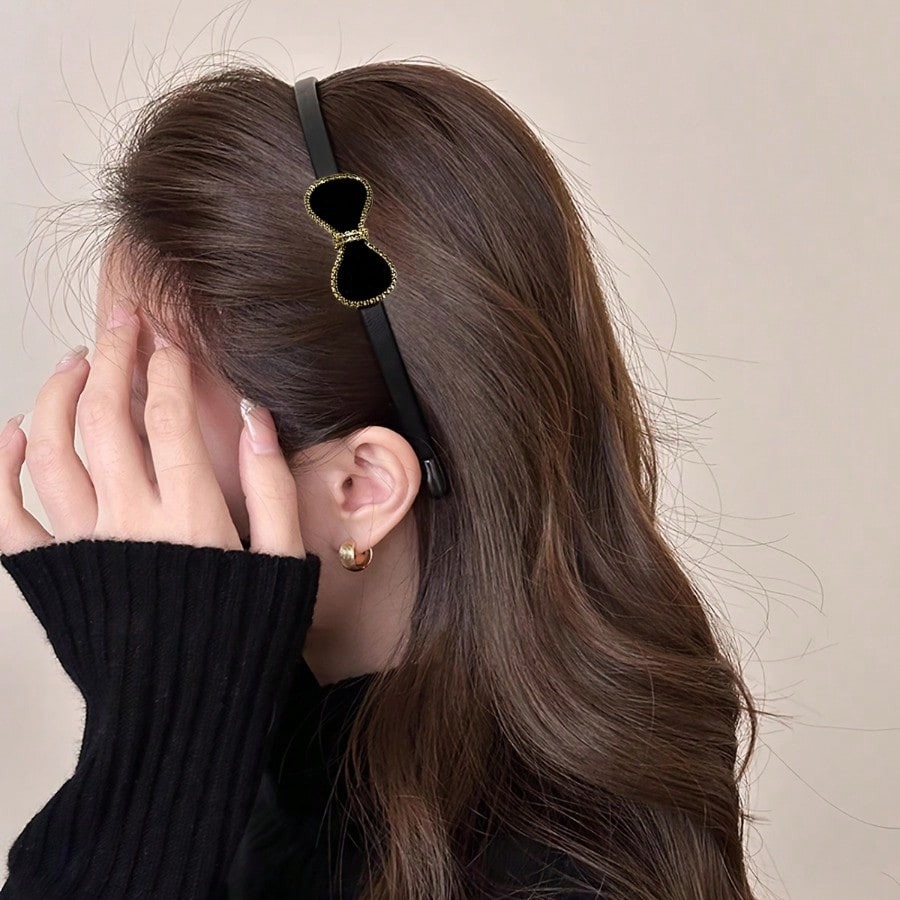 A Stylish Thin Headband Women Featuring A Bow