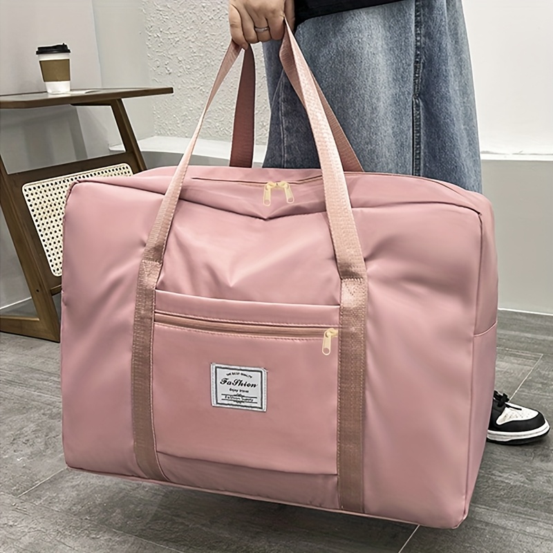 商品图片 1个大容量加厚牛津布收纳袋 - 粉色/黑色，多用途旅行、健身和衣物收纳袋，带宽敞主袋，便携式单肩背带，可装床上用品、衣物、搬家用品 - 耐用且可机洗