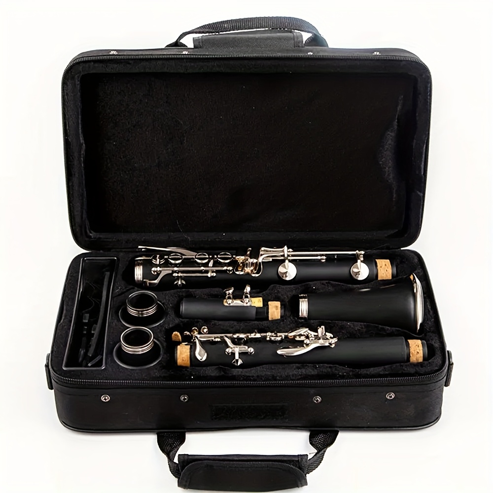   black clarinet suitable for b flat clarinet groups designed for solo   performances   a black case for musicians