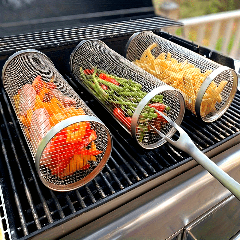 A Portable Cylindrical Stainless Steel Grill for Outdoor Camping, Featuring a Rotating And Rolling Barbecue Basket, a Barbecue Stand, And a Circular Stove Suitable for Camping And Picnics, Ideal for Outdoor Cooking