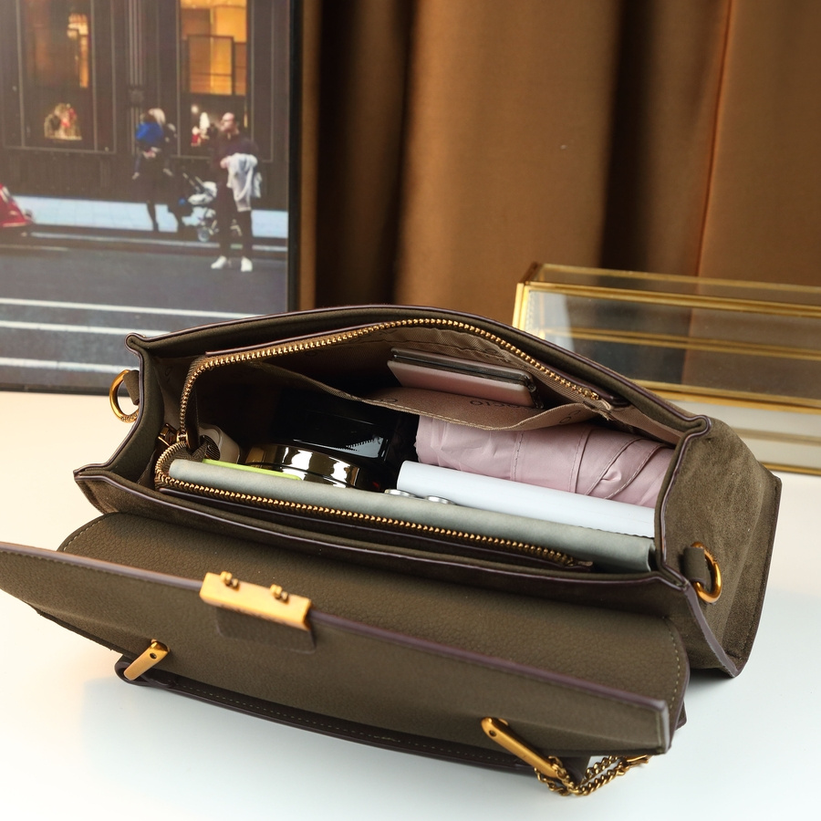 Handbag on chair with coat