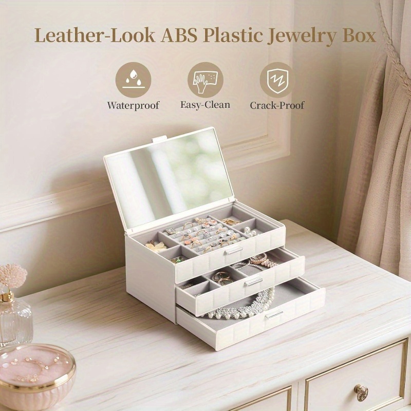 women s large jewelry box organizer with   - waterproof & dustproof heavy-duty plastic construction, white   leather-like texture, golden-  hinges & clear drawers - medium size with soft cushioned compartments for earrings, rings, necklaces, bracelets storage -     for home or travel, large jewelry organizer storage, jewelry box, jewellery box packaging, jewelry storage organizer, small jewelery holder Product details 3